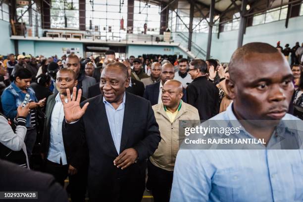 South African President Cyril Ramaphosa waves to supporters upon his arrival for a meeting of the South African ruling Party African National...