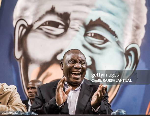 South African President Cyril Ramaphosa applauds during a meeting of the South African ruling Party African National Congress "Thuma Mina" campaign...