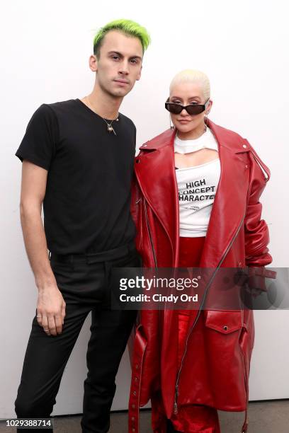 Designer Christian Cowan and Christina Aguilera pose backstage at the Christian Cowan Show during New York Fashion Week at Gallery II at Spring...