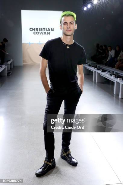 Designer Christian Cowan prepares backstage at the Christian Cowan Show during New York Fashion Week at Gallery II at Spring Studios on September 8,...