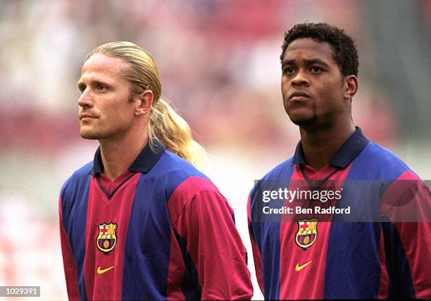 Emmanuel Petit and Patrick Kluivert of Barcelona line-up before the Pre-Season Friendly Tournament against Lazio held at the Amsterdam ArenA, in...