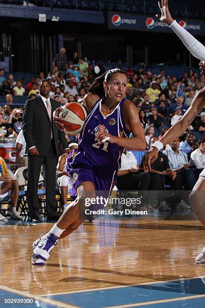 Ticha Penicheiro of the Los Angeles Sparks drives to the baske during the WNBA game against the Chicago Sky on July 16, 2010 at the All-State Arena...