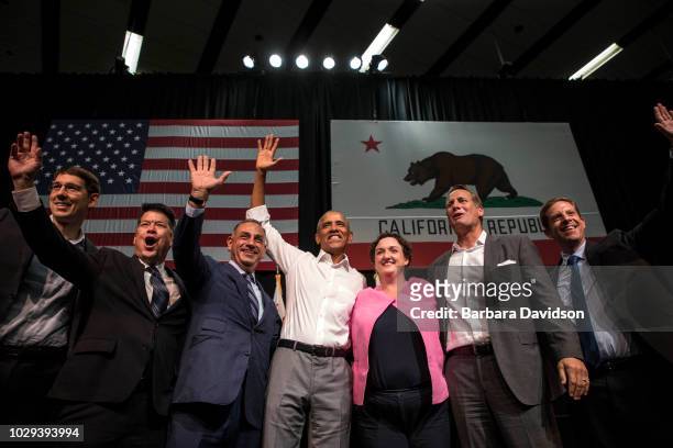 Josh Harder , TJ Cox , Gil Cisneros , former U.S. President Barack Obama, Katie Porter , Harley Rouda , and Mike Levin wave to supporters during a...