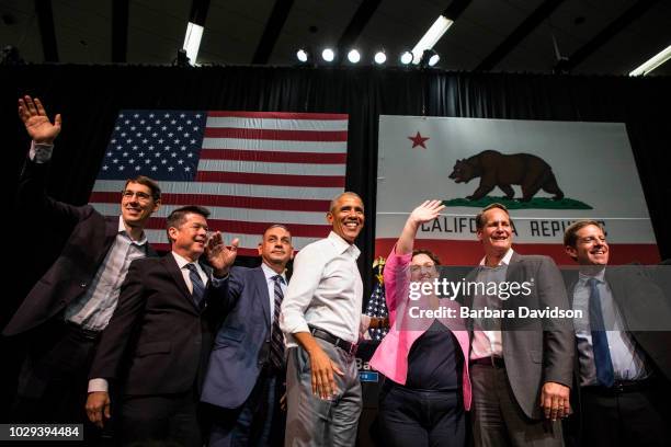 Josh Harder , TJ Cox , Gil Cisneros , former U.S. President Barack Obama, Katie Porter , Harley Rouda , and Mike Levin wave to supporters during a...