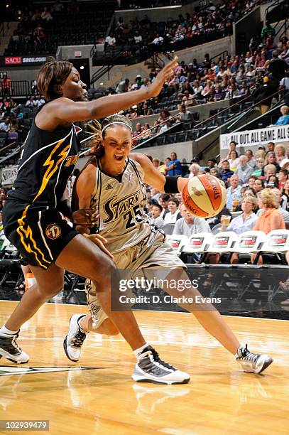 Becky Hammon of the San Antonio Silver Stars drives against Amber Holt of the Tulsa Shock on July 16, 2010 at the AT&T Center in San Antonio, Texas....