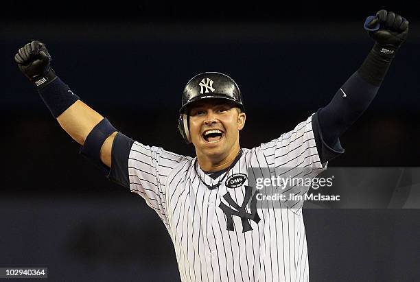 Nick Swisher of the New York Yankees celebrates his game winning RBI base hit in the ninth inning against the Tampa Bay Rays on July 16, 2010 at...