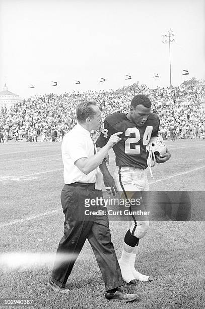 Oakland Raiders coach Al Davis on field with Fred "The Hammer" Williamson during game vs Buffalo Bills. Oakland, CA 9/15/1963 CREDIT: Curt Gunther