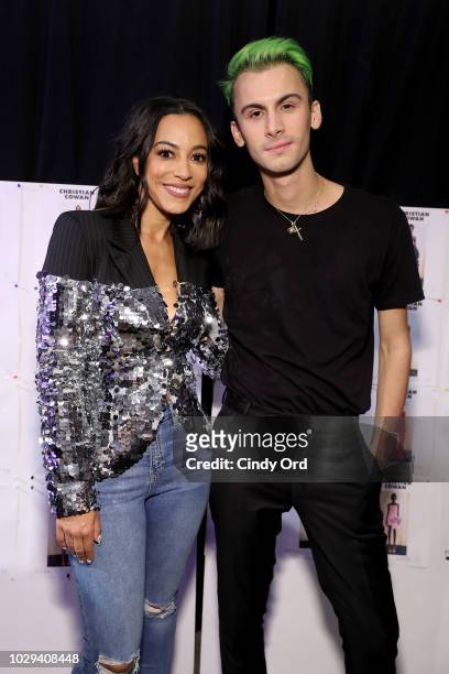 Angela Rye and designer Christian Cowan pose backstage at the Christian Cowan Show during New York Fashion Week at Gallery II at Spring Studios on...