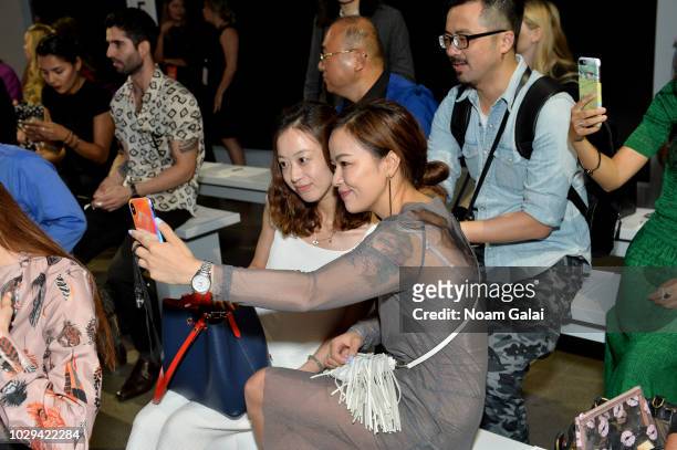Guests take photos on their cel phones at the Taoray Wang show in gallery II during New York Fashion Week: The Shows on September 8, 2018 in New York...