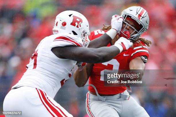 Chase Young of the Ohio State Buckeyes rushes against Kamaal Seymour of the Rutgers Scarlet Knights in the first quarter of the game at Ohio Stadium...