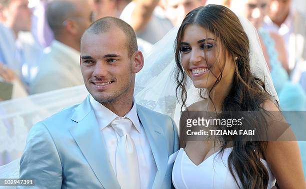 Inter-Milan's Dutch football player Wesley Sneijder and Dutch model Yolanthe Cabau pose outside the Church of San Giusto e Clemente in Castelnuovo...