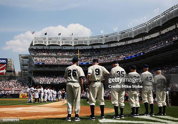 Members of the 1950 World Championship team, Jerry Coleman, Don Johnson, Duane Pillette, Charlie Silvera, Hank Workman and Whitey Ford look on during...