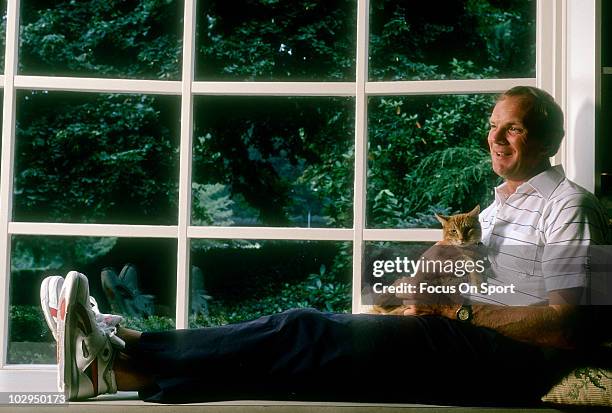 Head Coach Sam Wyche of the Cincinnati Bengals at home holding his cat in this portrait circa 1989. Wyche was head coach of the Bengals from 1984-91.