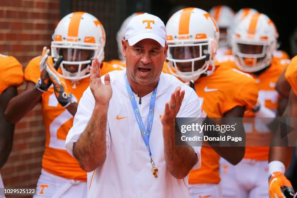 Head coach Jeremy Pruitt of the Tennessee Volunteers brings his team onto the field prior to a game against the East Tennessee State University...