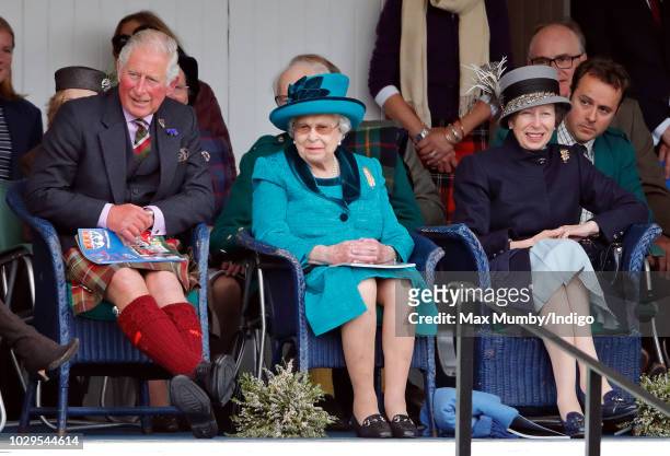 Prince Charles, Prince of Wales, Queen Elizabeth II and Princess Anne, Princess Royal attend the 2018 Braemar Highland Gathering at The Princess...