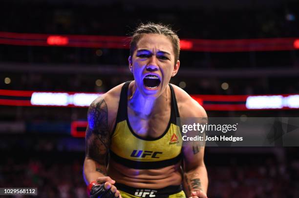 Jessica Andrade of Brazil celebrates after knocking out Karolina Kowalkiewicz of Poland in their women's strawweight fight during the UFC 228 event...