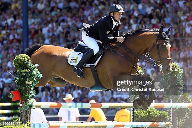 Marcus Ehning of Germany rides on Noltes Kuechengirl during the Rolex Grand Prix Jumping competition of the CHIO on July 18, 2010 in Aachen, Germany.