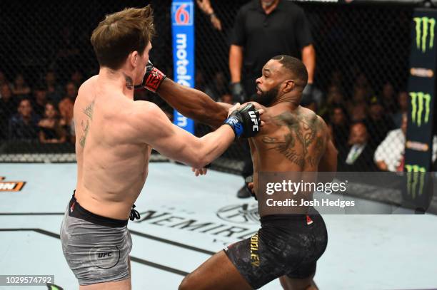 Tyron Woodley punches Darren Till of England in their UFC welterweight championship fight during the UFC 228 event at American Airlines Center on...