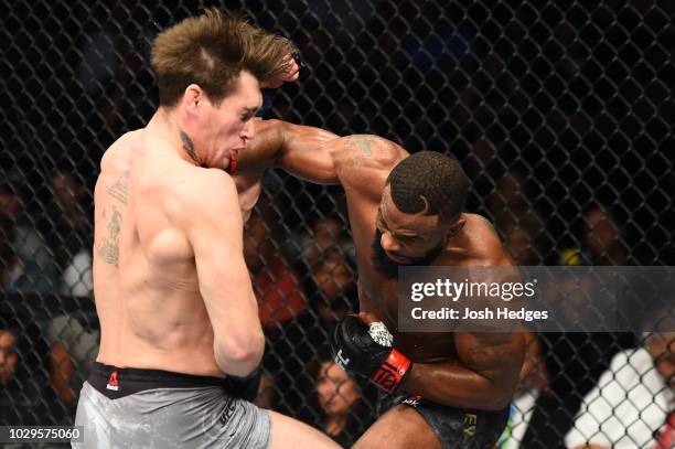 Tyron Woodley punches Darren Till of England in their UFC welterweight championship fight during the UFC 228 event at American Airlines Center on...