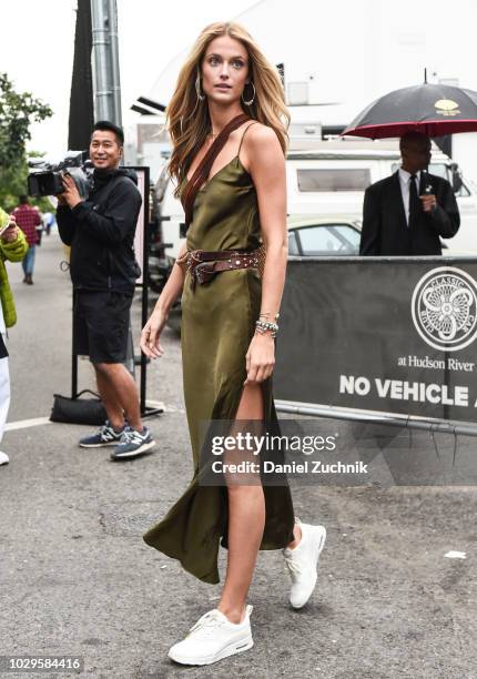 Kate Bock is seen wearing a green slip dress outside the Brandon Maxwell show during New York Fashion Week: Women's S/S 2019 on September 8, 2018 in...