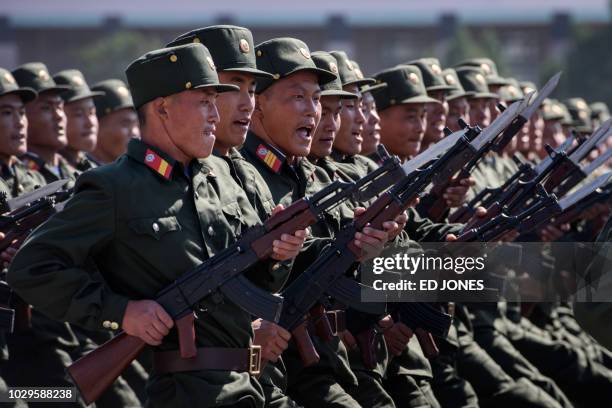 Korean People's Army soldiers march during a mass rally on Kim Il Sung square in Pyongyang on September 9, 2018. - North Korea held a military parade...
