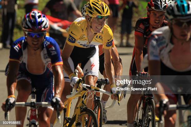 Luxembourg's Andy Schleck, in the yellow jersey, chases Spain�s Alberto Contador on the final climb of Stage 14 of the Tour de France, the first...