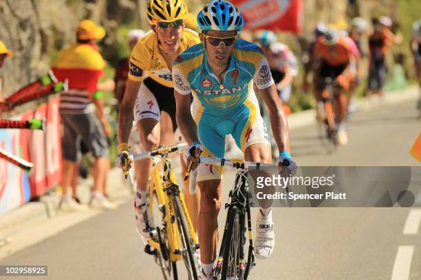 Luxembourg's Andy Schleck, in the yellow jersey, chases Spain�s Alberto Contador on the final climb of Stage 14 of the Tour de France, the first...