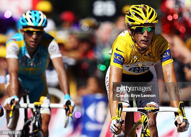 Race leader Andy Schleck of Luxembourg and Team Saxo Bank leads Alberto Contador of Spain the Astana Team leads over the finishline on stage fourteen...