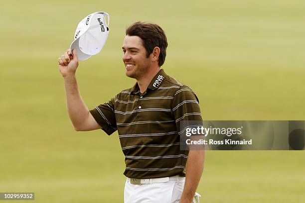 Louis Oosthuizen of South Africa celebrates his seven-stroke victory in the final round of the 139th Open Championship on the Old Course, St Andrews...