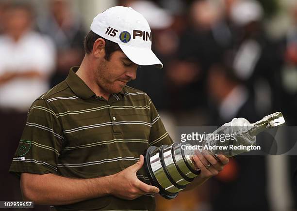 Louis Oosthuizen of South Africa looks at the winners names on the Claret Jug after his seven-stroke victory at the 139th Open Championship on the...