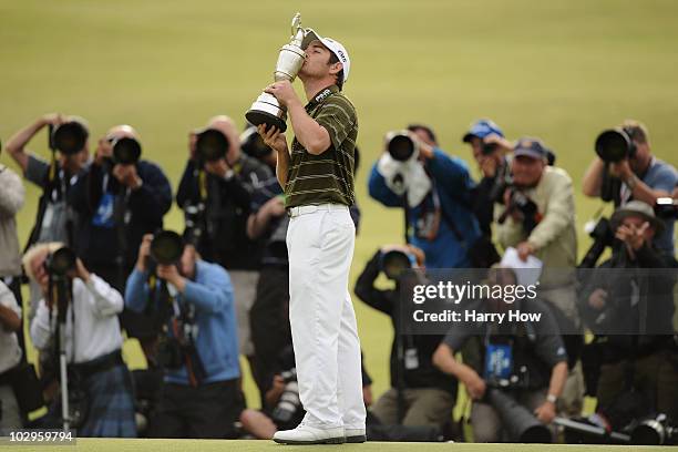 Louis Oosthuizen of South Africa is photographed as he kisses the Claret Jug after his seven-stroke victory at the 139th Open Championship on the Old...