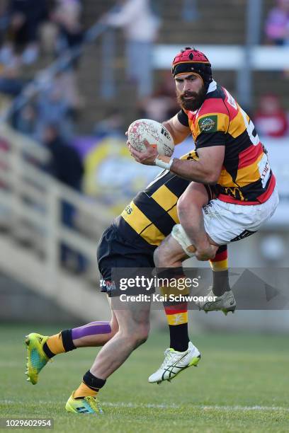 Adam Burn of Waikato is tackled during the round four Mitre 10 Cup Ranfurly Shield match between Taranaki and Waikato at Yarrow Stadium on September...