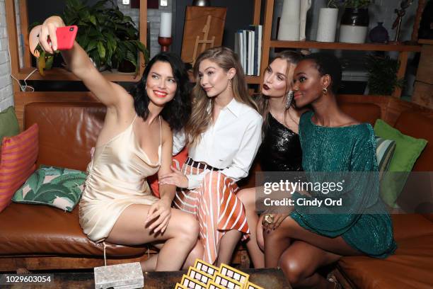 Adriana Lima, Gigi Hadid, Josephine Skriver and Herieth Paul take a selfie at the Maybelline x New York Fashion Week XIX Party at Mr. Purple at the...