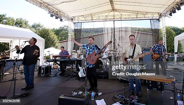 Joey Burns, John Convertino, Paul Niehaus, Jacob Valenzuela, Martin Wenk and Volker Zander of Calexico perform during the Green River Festival at...