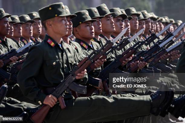 Korean People's Army soldiers march during a mass rally on Kim Il Sung square in Pyongyang on September 9, 2018. - North Korea was marking the 70th...
