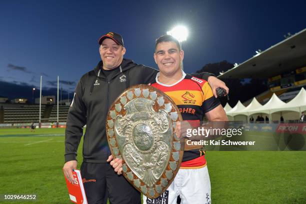 Head Coach Jono Gibbes of Waikato and captain Dwayne Sweeney of Waikato pose with the Ranfurly Shield after their win in the round four Mitre 10 Cup...