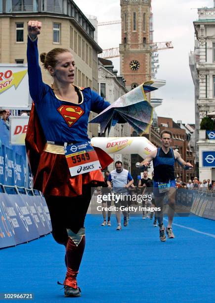 Boxer Ina Menzer crosses the winners line during the 'Everone' Dextro Energy Triathlon ITU World Cup on July 17, 2010 in Hamburg, Germany.