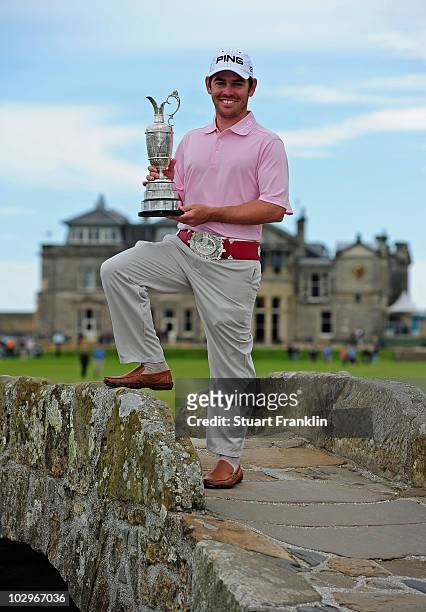Open Champion Louis Oosthuizen of South Africa poses with the Claret Jug on the Swilken bridge on July 19, 2010 in St Andrews, Scotland.