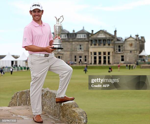 South African golfer Louis Oosthuizen stands on the Swilcan Bridge as he poses for pictures on July 19 with the Claret Jug after winning the 139th...