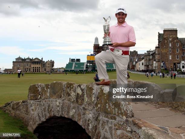 Open Champion Louis Oosthuizen of South Africa poses with the Claret Jug on the Swilken bridge on July 19, 2010 in St Andrews, Scotland