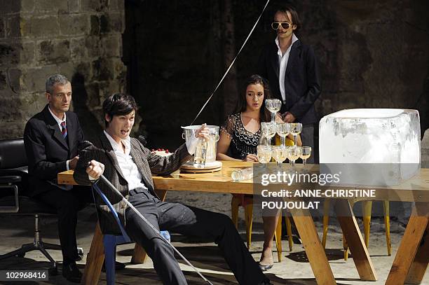 Comedians Thomas Landbo, Clotilde Hesme, Jeanne Tremsal and Mathieu Genet perform during a rehearsal of "Ball" by Bertolt Brecht directed by French...