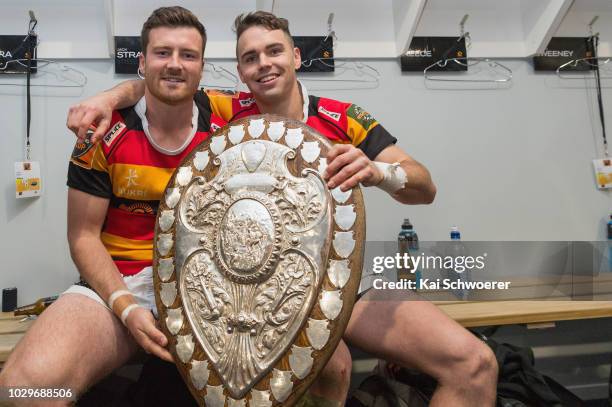 Jack Stratton and Fletcher Smith of Waikato pose with the Ranfurly Shield after the win in the round four Mitre 10 Cup Ranfurly Shield match between...