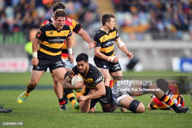 Regan Ware of Taranaki is tackled during the round four Mitre 10 Cup Ranfurly Shield match between Taranaki and Waikato at Yarrow Stadium on...