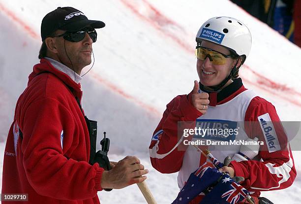 Jacqui Cooper talks to Australian aerial coach Peter Judge, after winning the first round of the 2000/2001 World Cup, during the Philips Mobile...