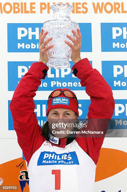 Jacqui Cooper celebrates with the trophy from the first round of the 2000/2001 World Cup, during the Philips Mobile Phones World Aerials, which is...