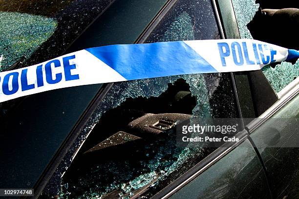 car with police banner, windows broken - car accident stock pictures, royalty-free photos & images