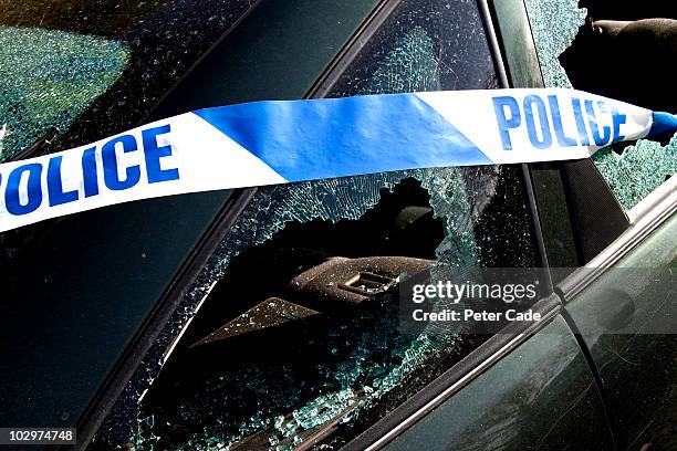 car with police banner, windows broken - acidente imagens e fotografias de stock