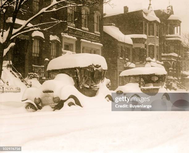 View of a cars buried in snow during the so-called Knickerbocker Storm, a blizzard that dropped 28 inches of snow on Washington DC, January 28, 1922....