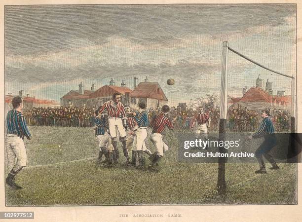 Engraving captioned 'The Association Game', of a game of football with a player jumping to head the ball toward the goal, circa 1888.