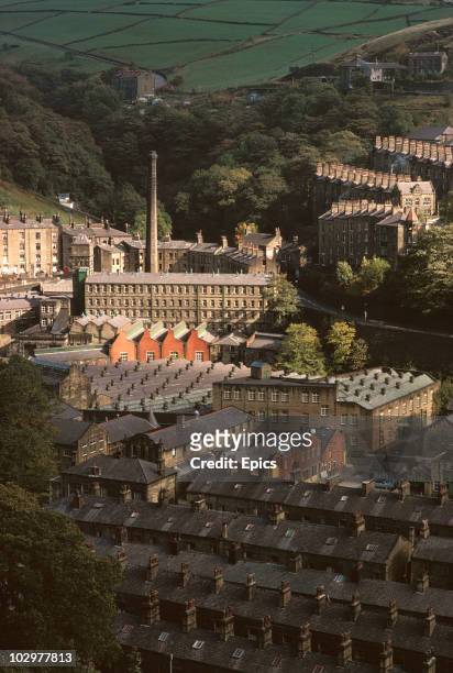 Wool mill is surrounded by terraced housing built for workers in a Pennine valley at Hebden Bridge.